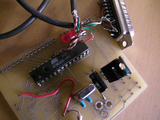 The first Arduino board ever made: a hand-wired prototype with an Atmel ATmega8 (date code 0409) and a DB9 serial connector.