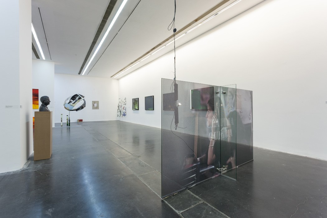 Glass sculpture and artworks installed in the bright galleries of Art Post-Internet at UCCA.