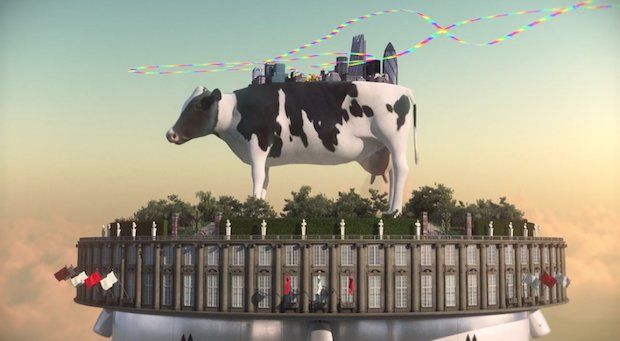 A giant cow carrying the London skyline floats above a circular building in Monaghan’s computer-animated Mothership.