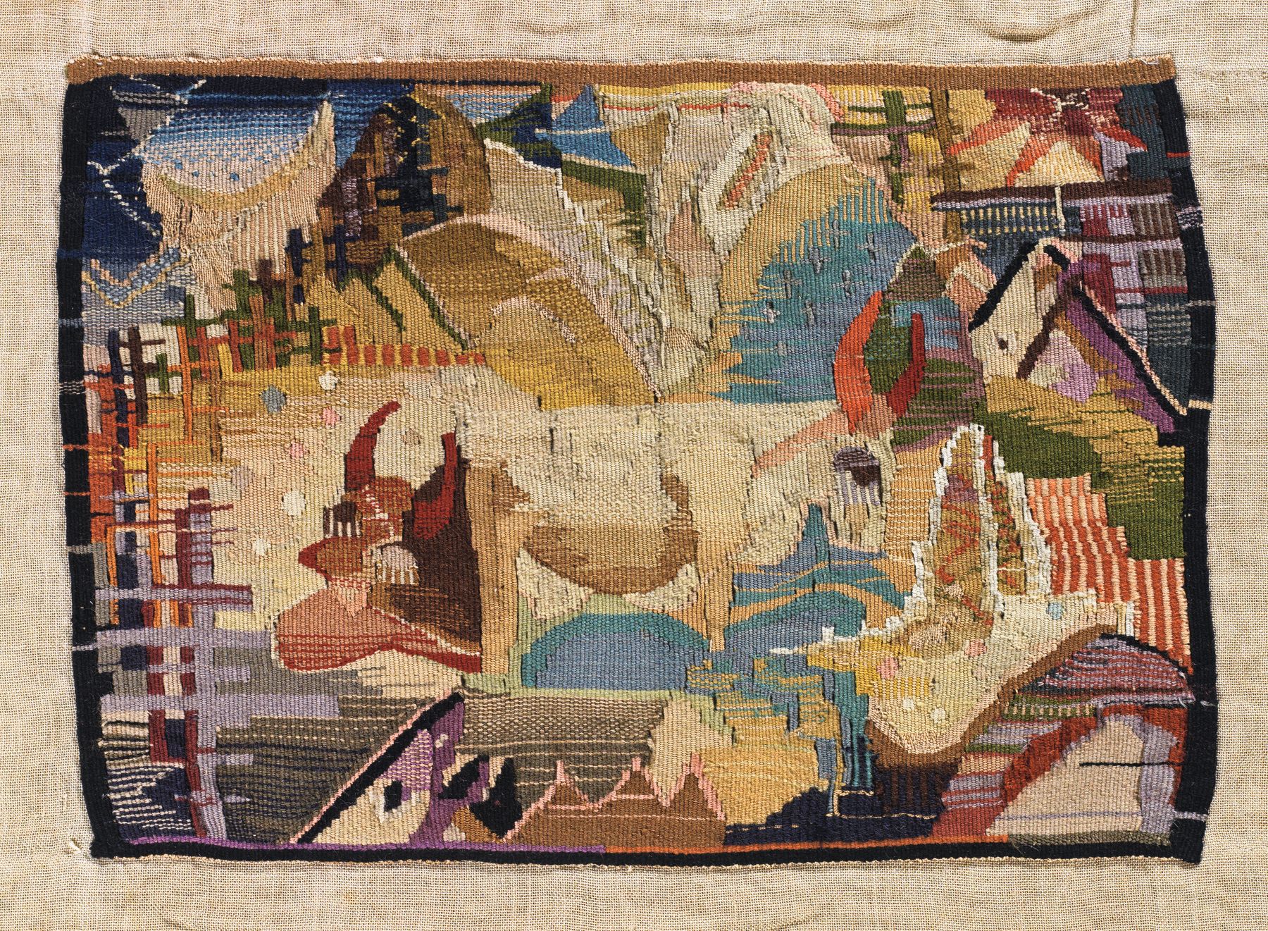 A brightly coloured woven landscape with cows, mountains and angular patches of blue, green, yellow, pink and red.
