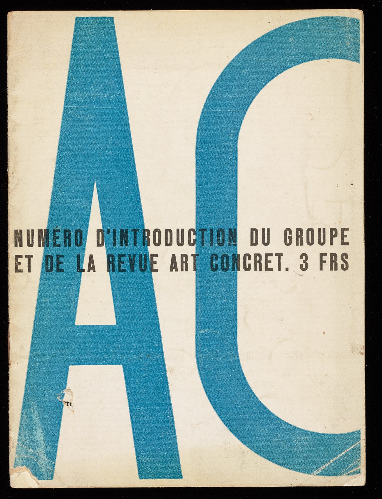 Worn cream Art Concret cover with enormous blue letters A and C and a black line of introductory text.