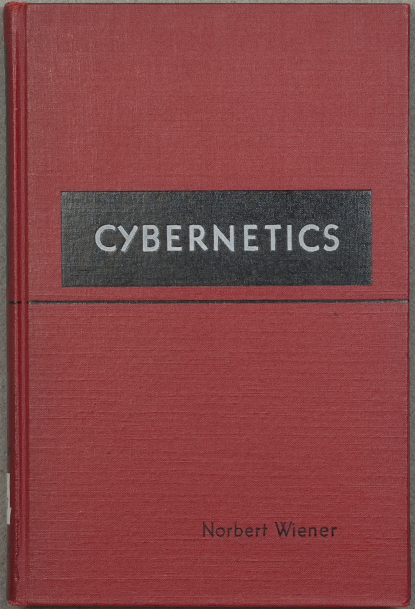 Red cloth cover of the 1948 first edition of Cybernetics, with its title in a black rectangular panel and Norbert Wiener's name near the lower right.