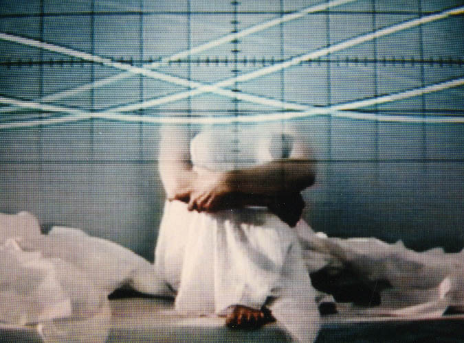 The Whitechapel Gallery's lead promotional image for Electronic Superhighway (2016-1966): a still from Lynn Hershman Leeson's video Seduction of a Cyborg (1994), a bandaged figure against a grid, rather than an installation view of the show.