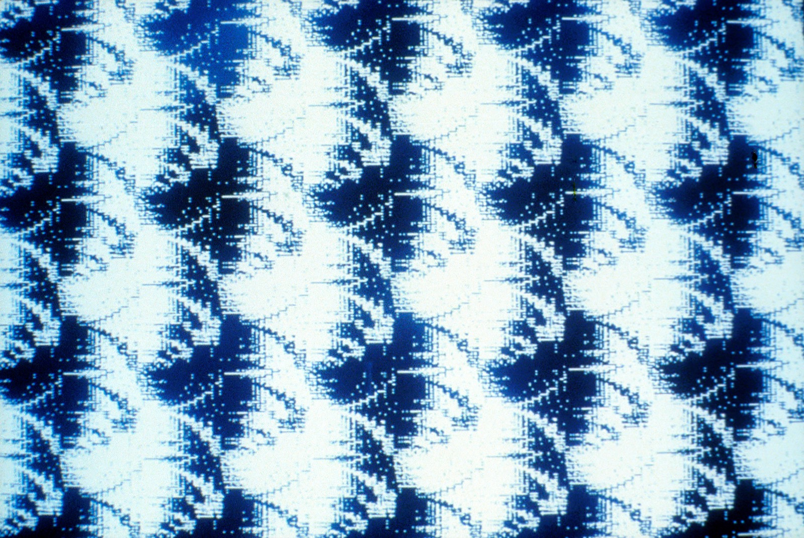 Hillary Kapan's Emerging Forms: a repeating blue-and-white lattice of crystalline shapes of the kind her program generated from a scattered field of pixels.