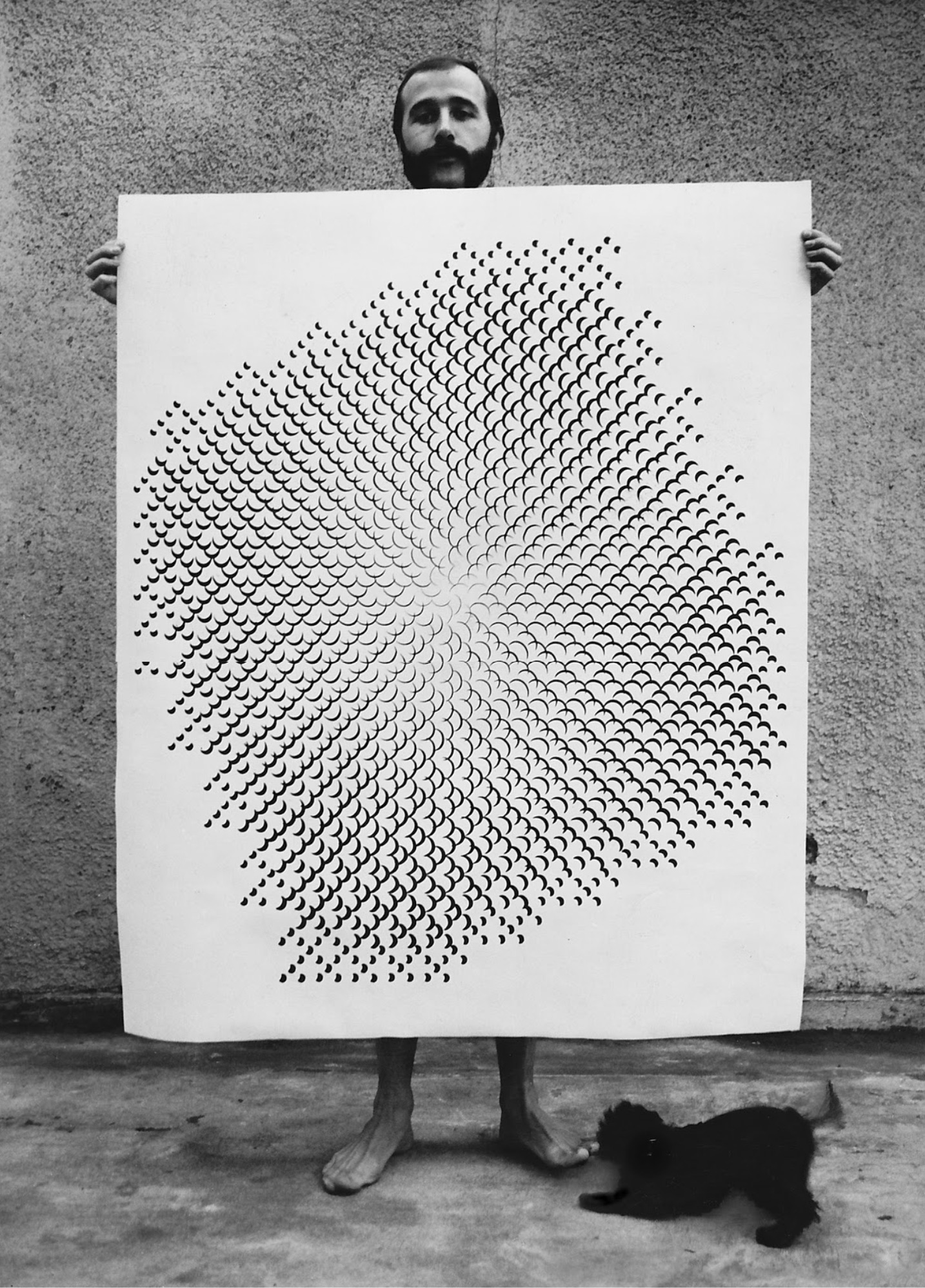 Gottfried Jager holding up one of his pinhole-structure photographs (Lochblendenstruktur); Jager initiated and named the 1968 Generative Fotografie exhibition at the Bielefeld Kunsthaus.