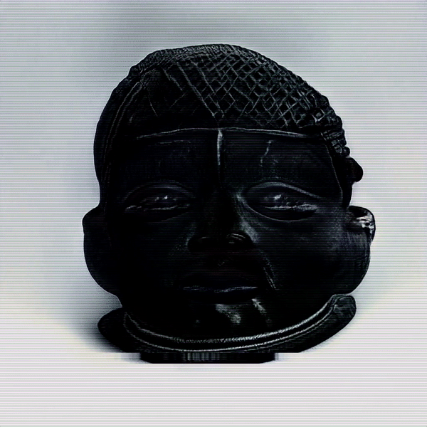 A dark synthetic Benin ceremonial head with a patterned crown, shown against a pale background in IGÚN.