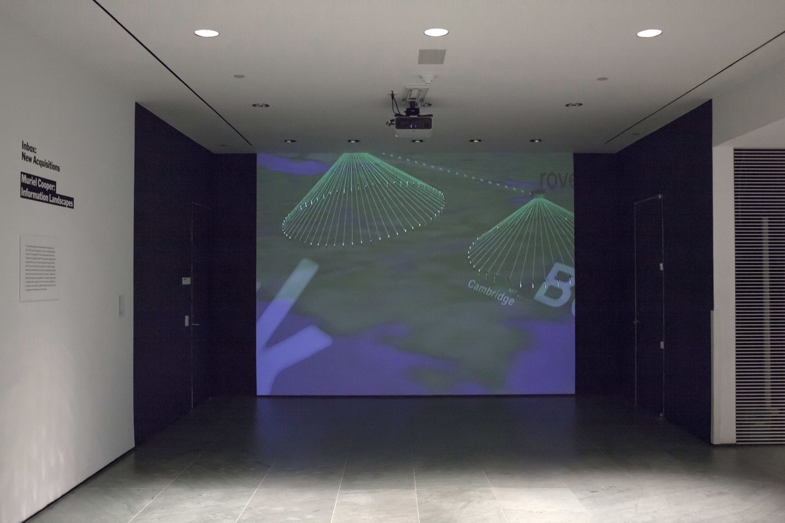 Installation view of Information Landscapes projected at the Museum of Modern Art for Inbox: Muriel Cooper's Information Landscapes, 2016 — three-dimensional typography flying over a mapped landscape labelled 'Cambridge'.
