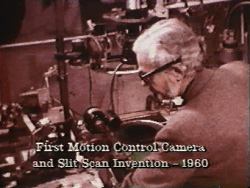 John Whitney Sr. with motion-control apparatus, in an archival frame reproduced by the ACM SIGGRAPH Digital Art Archive for Motion Graphics Incorporated.