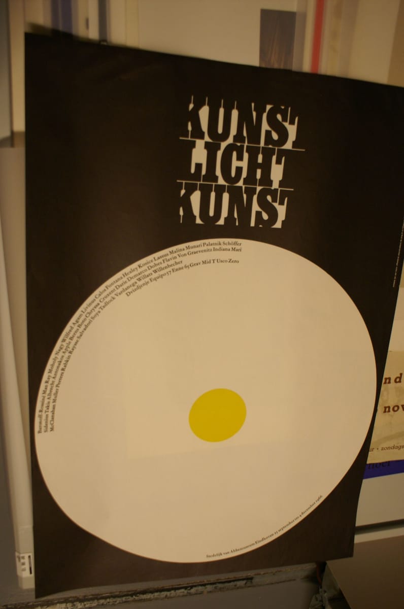 The 1966 poster for Kunst Licht Kunst at the Stedelijk van Abbemuseum, Eindhoven, designed by Jan van Toorn — stencilled title over a large white disc with a yellow centre — photographed in the museum’s archive.