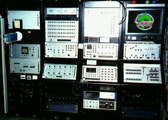 A Scanimate animation system with banks of knobs, patch panels and a color monitor showing an animated title.