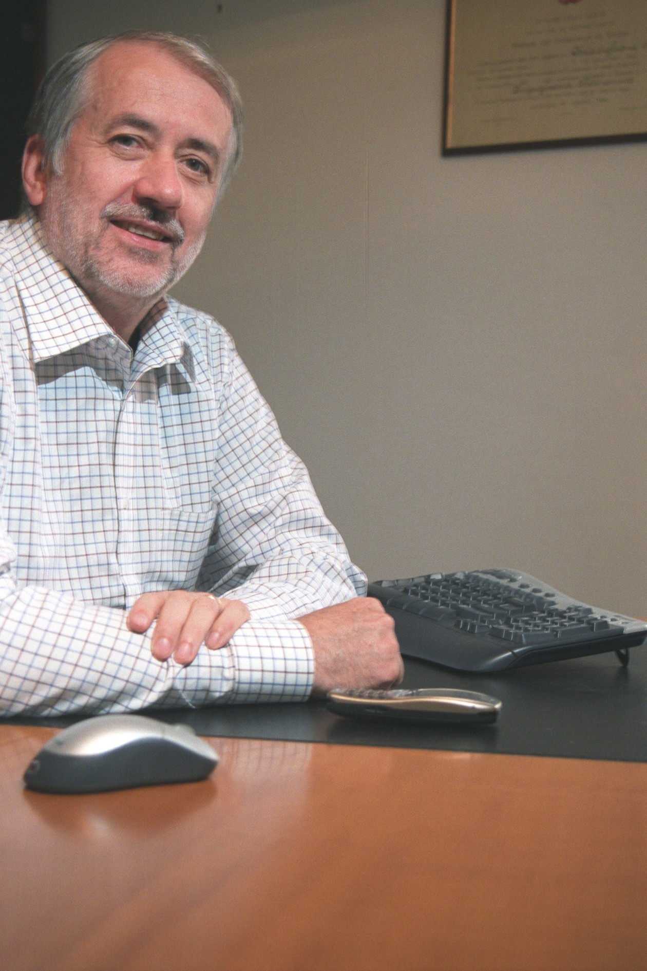 A photographic portrait of Leonardo Chiariglione, who founded MPEG with Hiroshi Yasuda in 1988 and convened it for three decades, seated at his desk in 2011.
