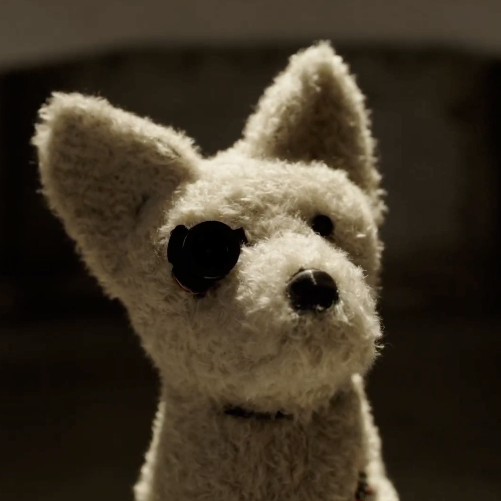 Mario Klingemann's A.I.C.C.A., the robotic critic-dog listed in this entry, which looks at an artwork and excretes a printed review as a paper receipt.