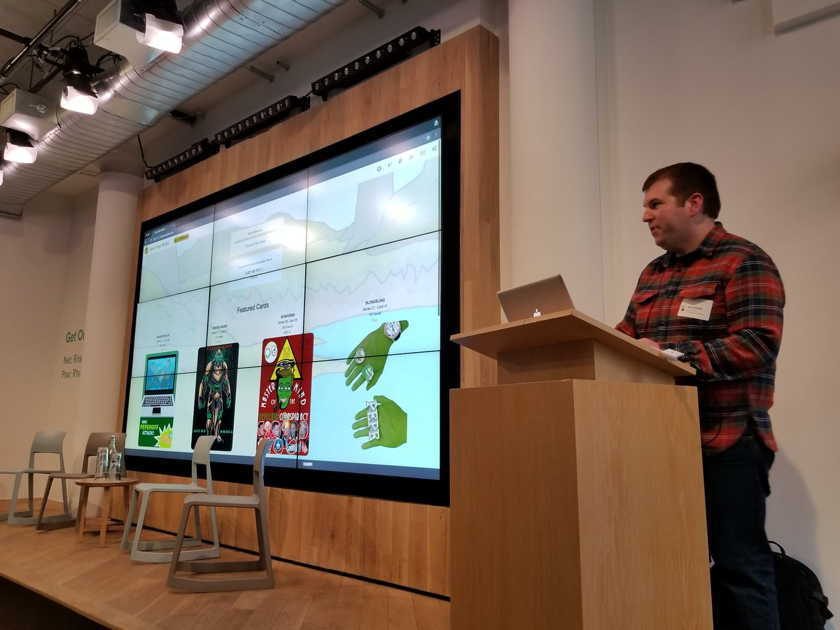 A photograph from the first Rare Digital Art Festival: Joe Looney of Rare Pepe Wallet presenting on stage.