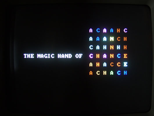 The title screen of Roman Verostko's The Magic Hand of Chance, photographed off the monitor, from the artist's own documentation of the 1982-85 software work.