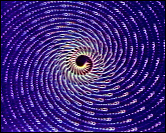 A frame from Spiral 5 PTL showing the spiral motif generated with the Sandin Image Processor and DeFanti's GRASS system.